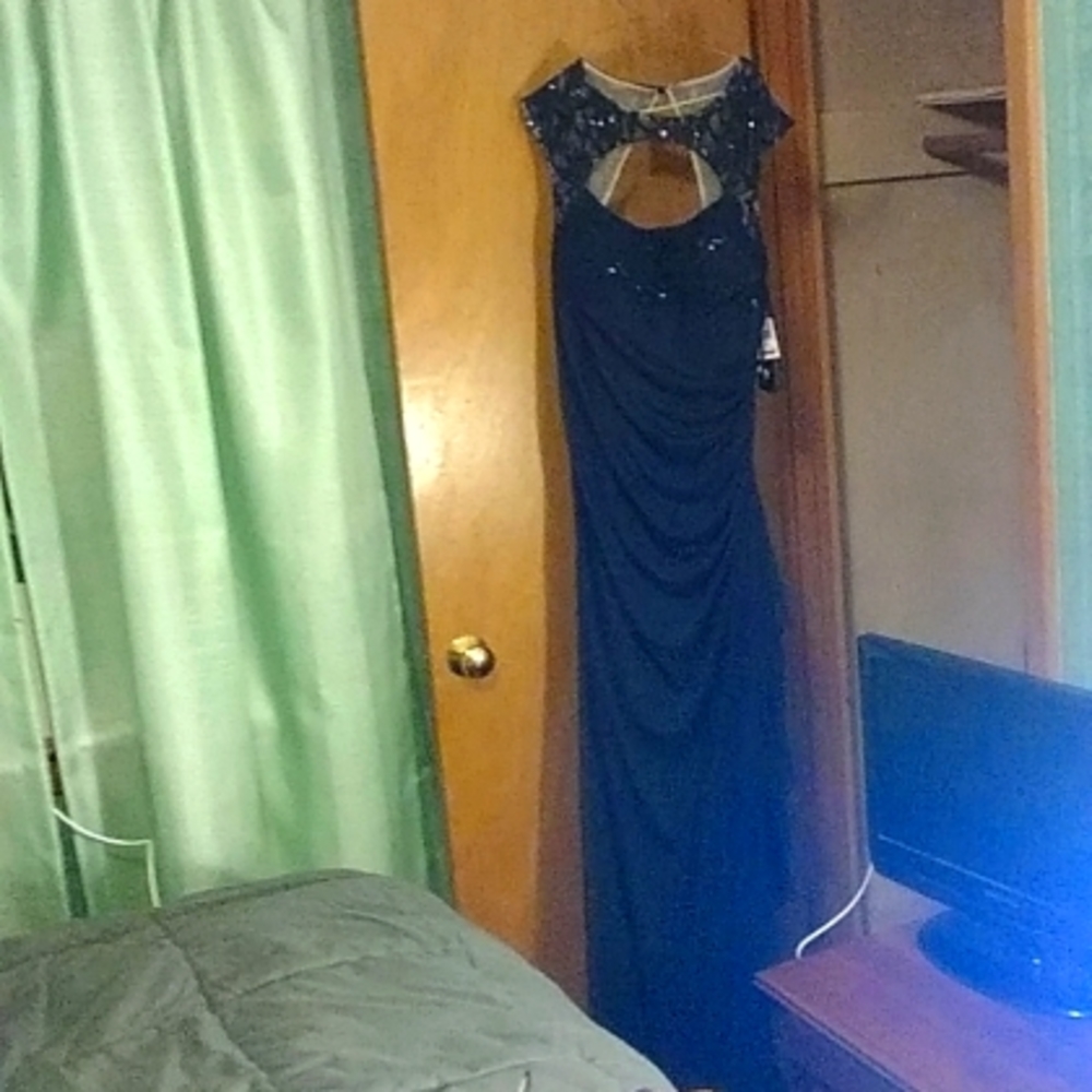 Betsy & Adam navy blue size 14 floor length gown. Rouched sides and full zipper